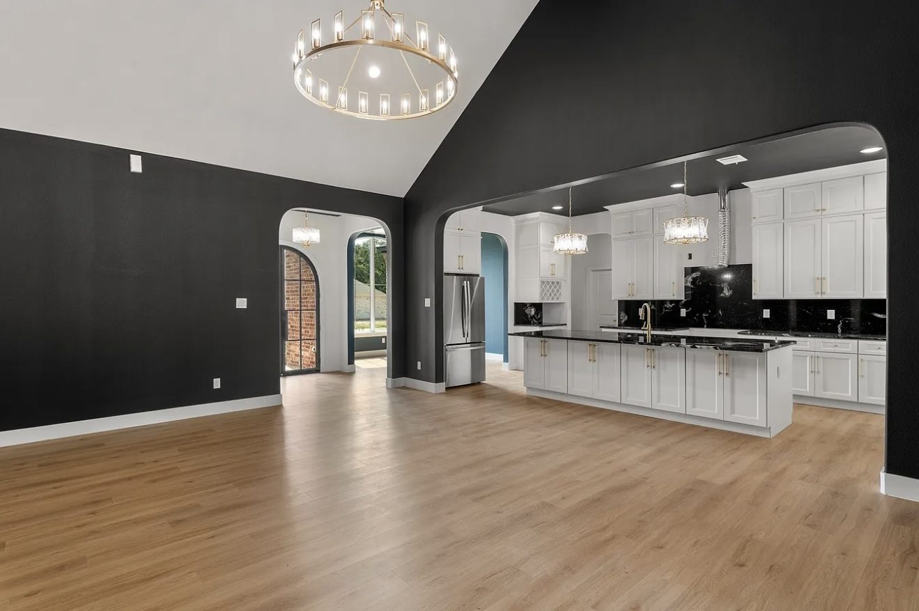 Renovated kitchen and great room with black feature wall