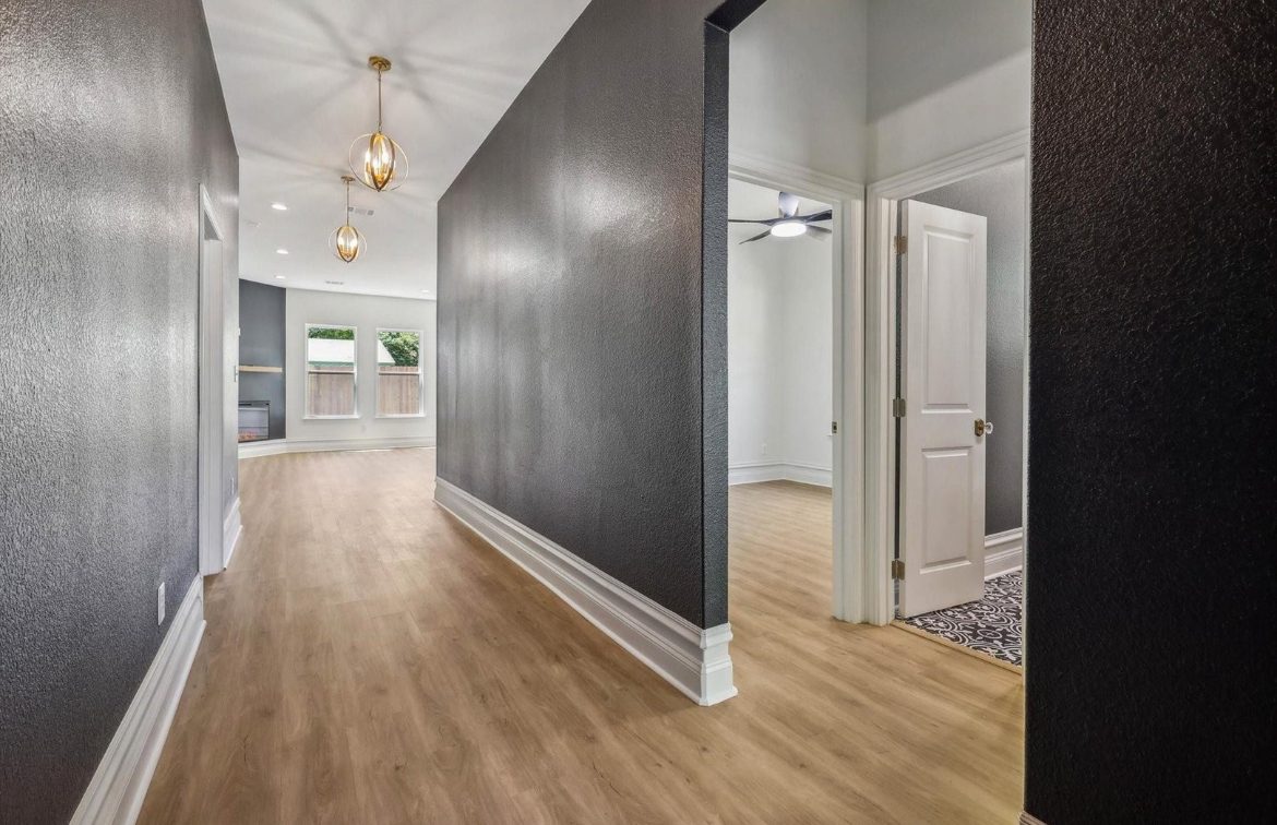 Renovated hallway with dark accent wall