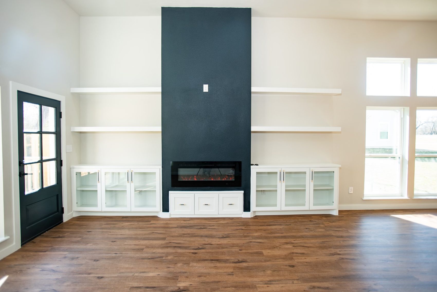 Living room with built-ins and fireplace